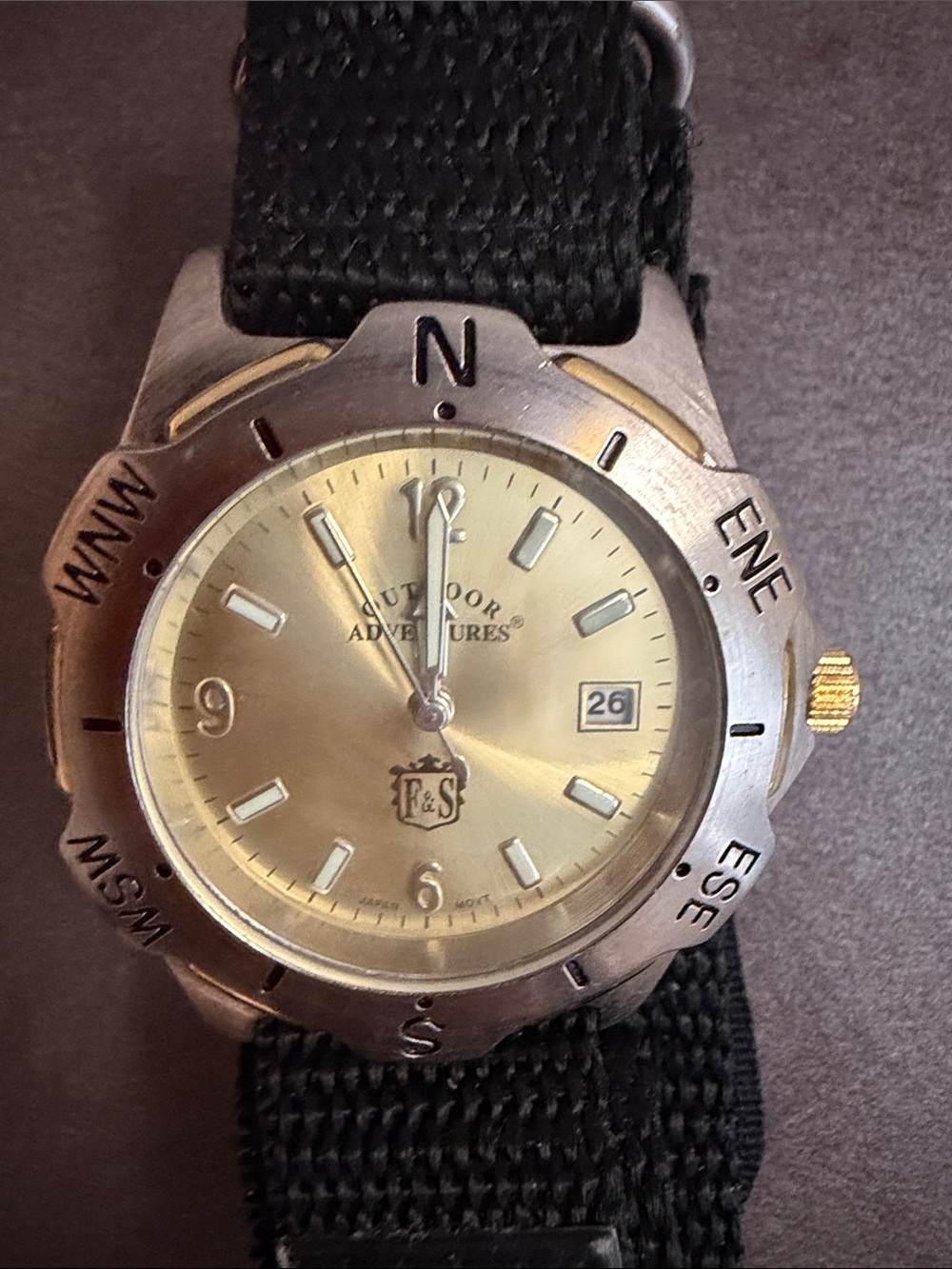 Field & Stream Gold Dial Compass Bezel Watch Black Nylon Strap needs battery